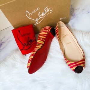 Louboutin Striped Peep toe flats.
